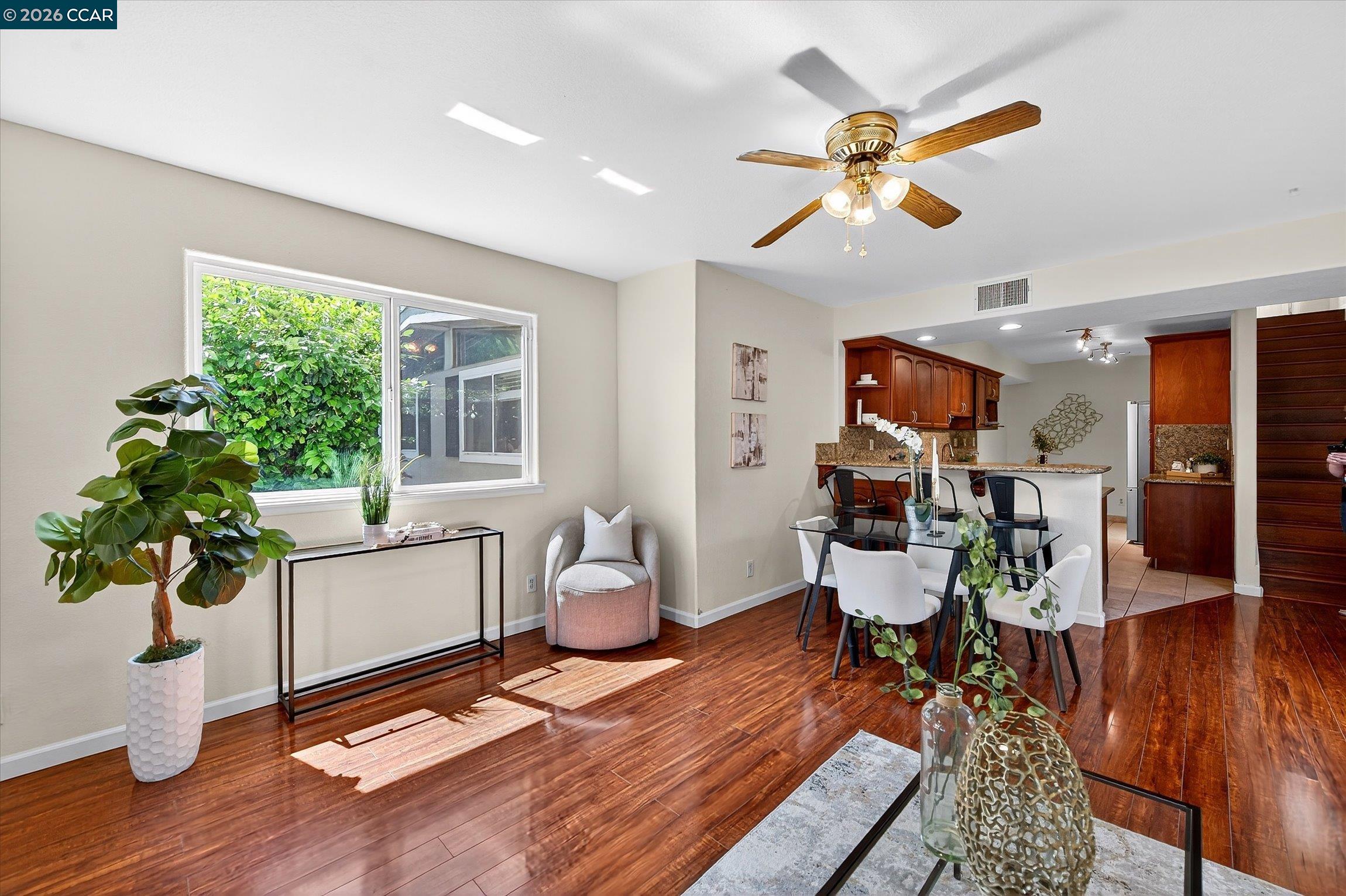 2659 3rd Street Livermore, CA 94550 - Photo 23 of 40 a living room with dining room and wooden floor