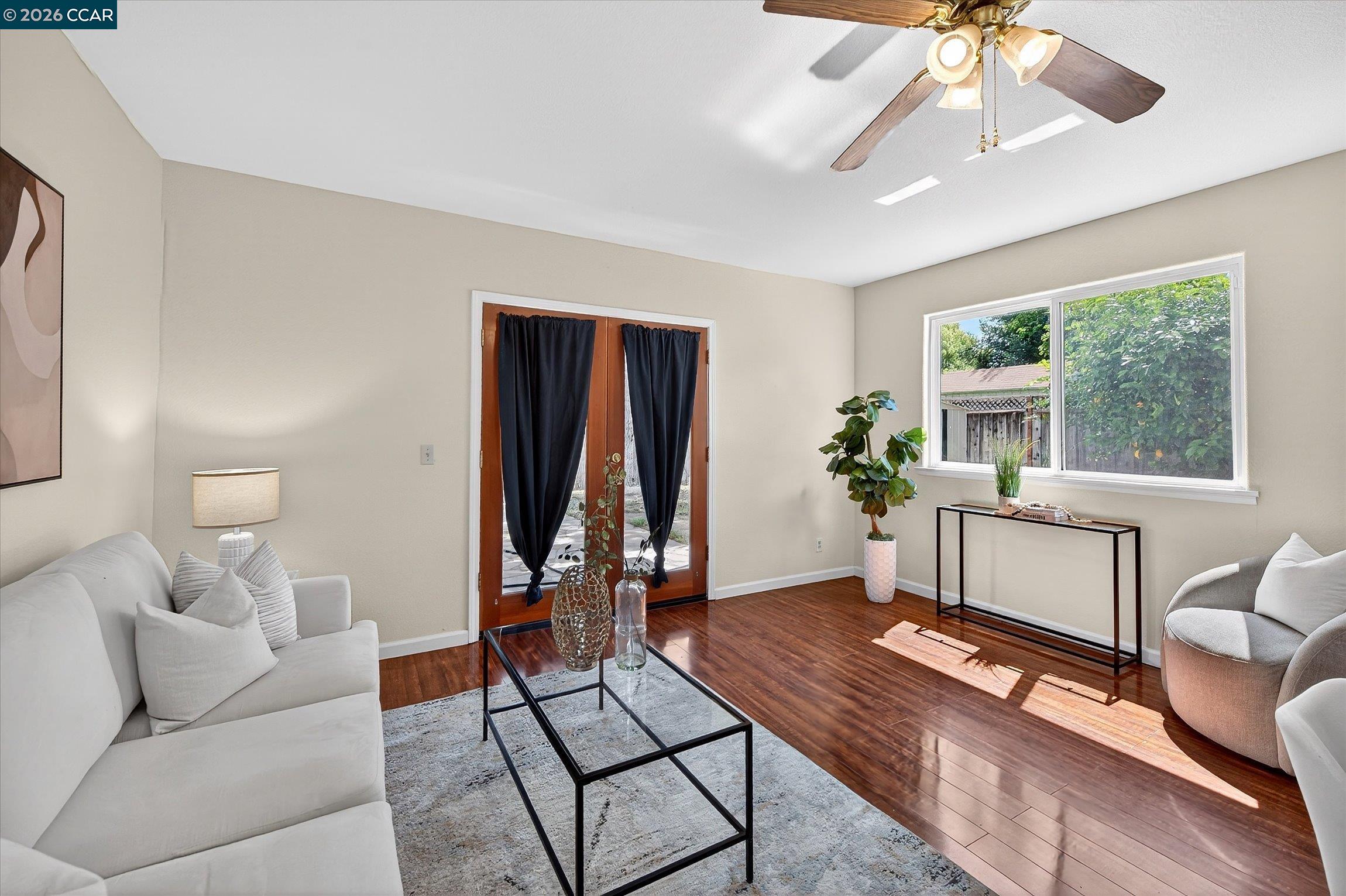2659 3rd Street Livermore, CA 94550 - Photo 24 of 40 a living room with furniture a window and a chandelier