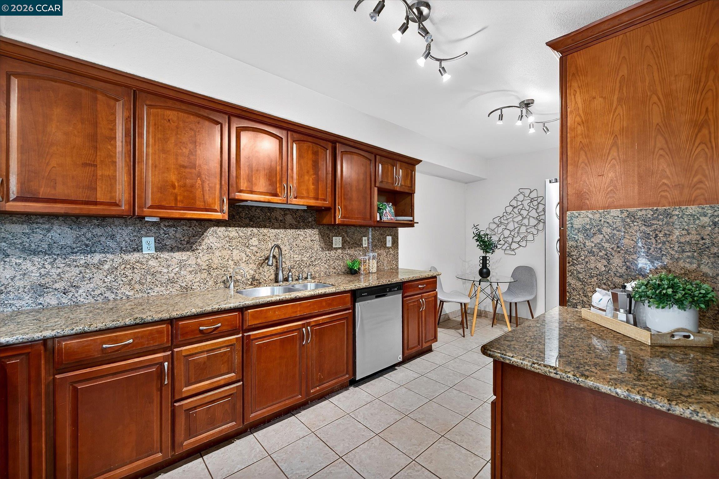 2659 3rd Street Livermore, CA 94550 - Photo 25 of 40 a kitchen with stainless steel appliances granite countertop wooden cabinets a sink and dishwasher