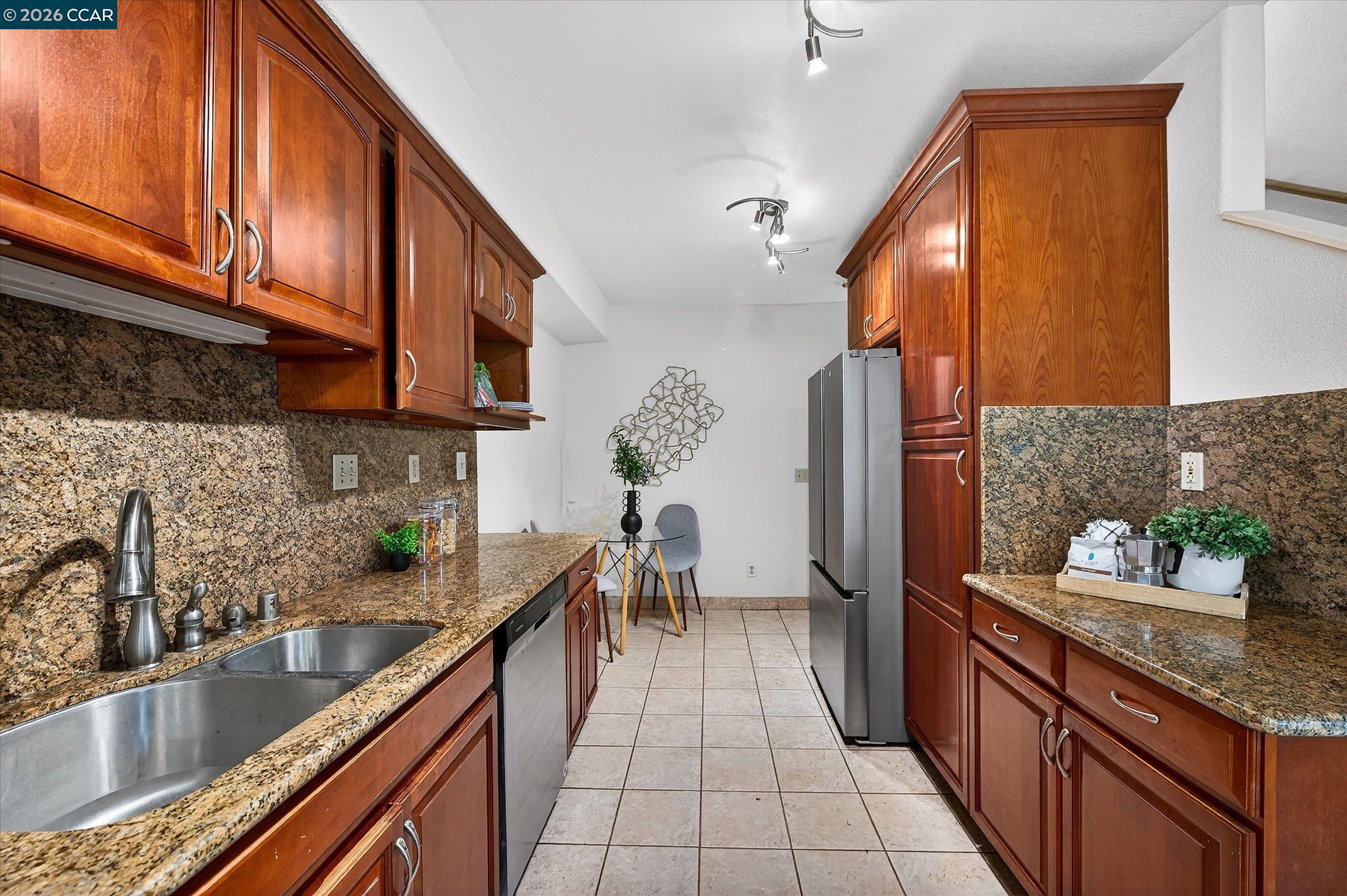 2659 3rd Street Livermore, CA 94550 - Photo 26 of 40 a kitchen with stainless steel appliances granite countertop a sink and a refrigerator