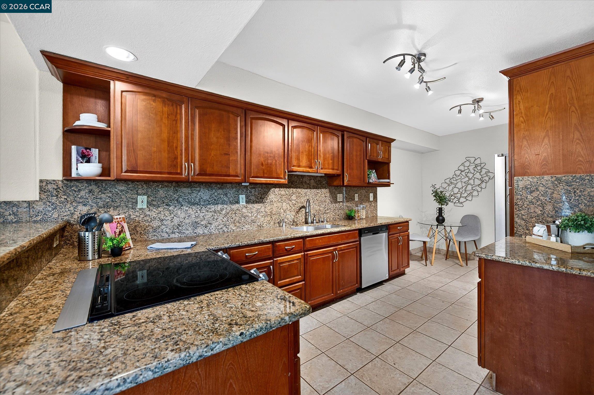 2659 3rd Street Livermore, CA 94550 - Photo 28 of 40 a kitchen with stainless steel appliances granite countertop a sink stove and cabinets