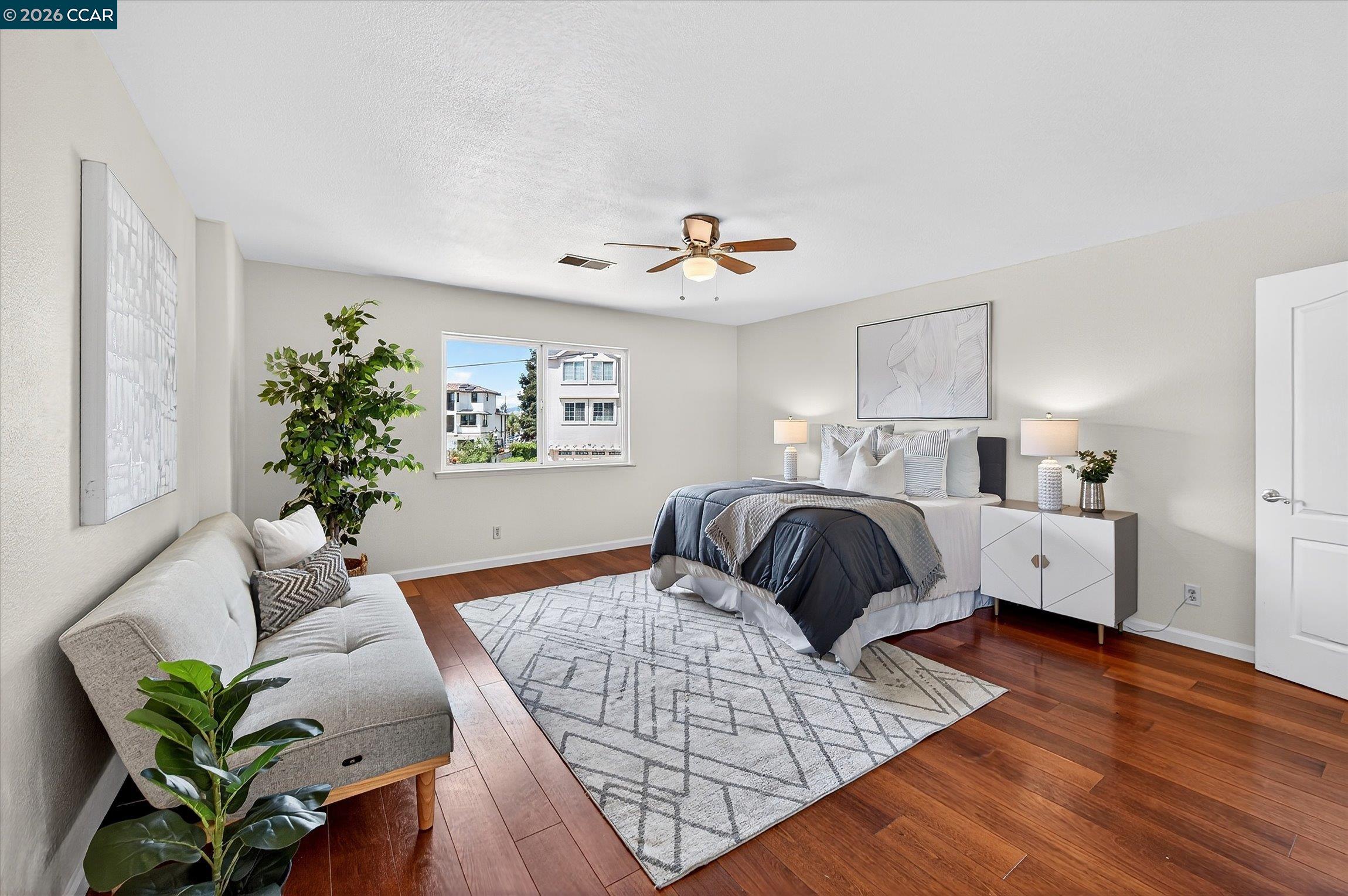 2659 3rd Street Livermore, CA 94550 - Photo 36 of 40 a bedroom with furniture and a potted plant