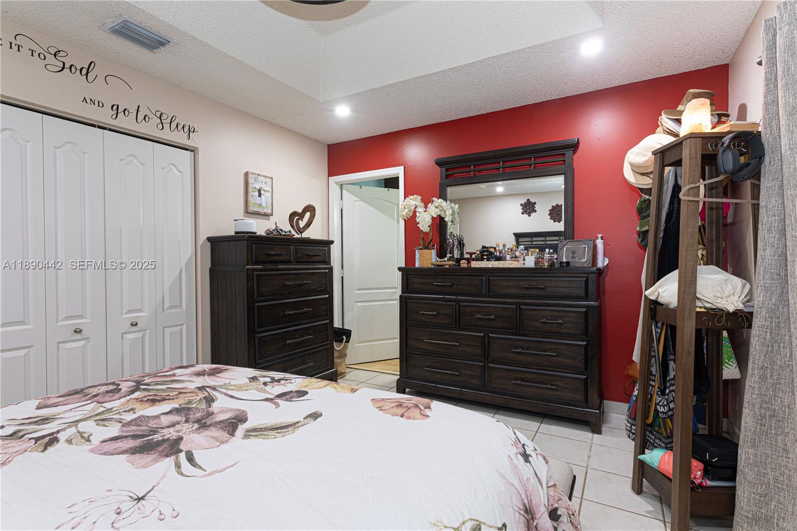 4810 Southwest 153rd Terrace Miramar, FL 33027 - Photo 17 of 41 a bedroom with a bed and a dresser