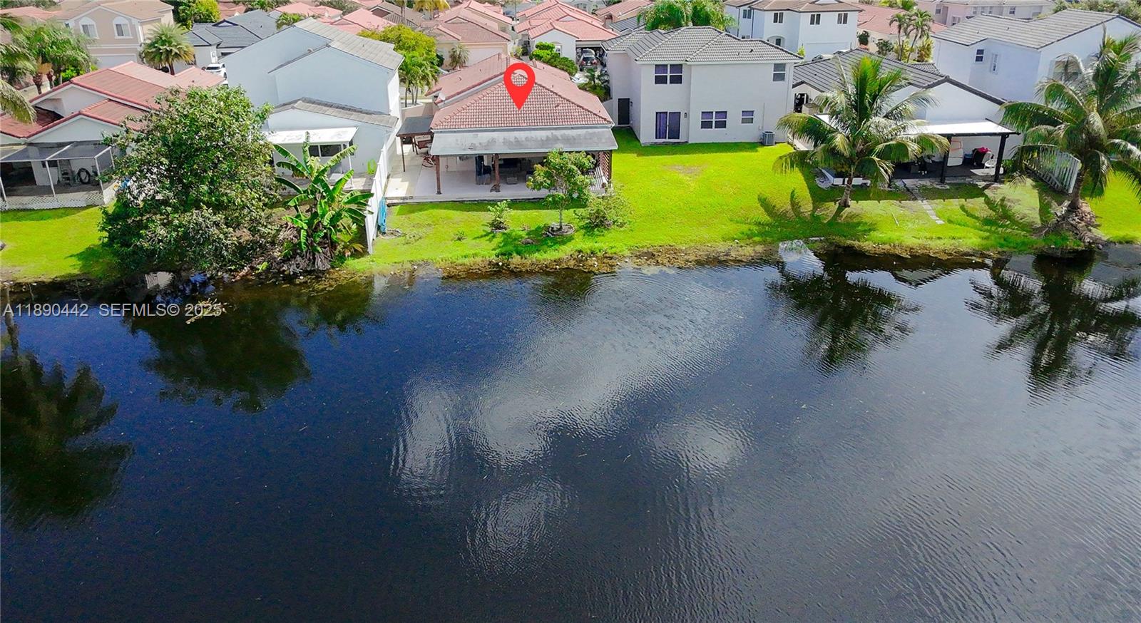 4810 Southwest 153rd Terrace Miramar, FL 33027 - Photo 28 of 41 an aerial view of a house with a garden and lake view
