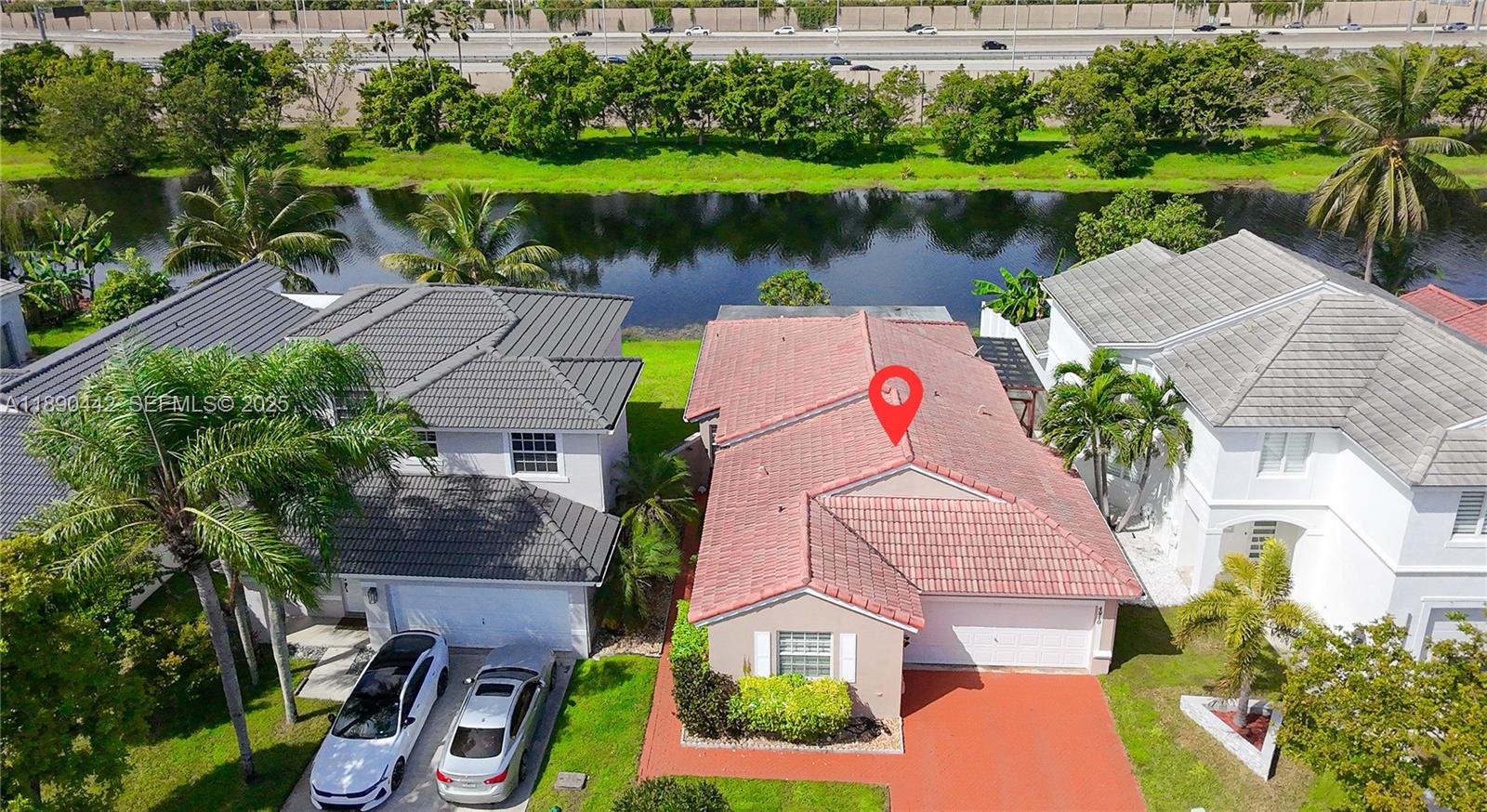 4810 Southwest 153rd Terrace Miramar, FL 33027 - Photo 30 of 41 an aerial view of house with yard and lake view