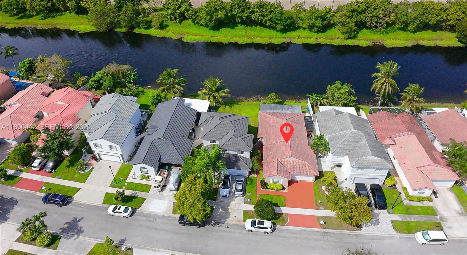 4810 Southwest 153rd Terrace Miramar, FL 33027 - Photo 31 of 41 an aerial view of lake and houses with outdoor space