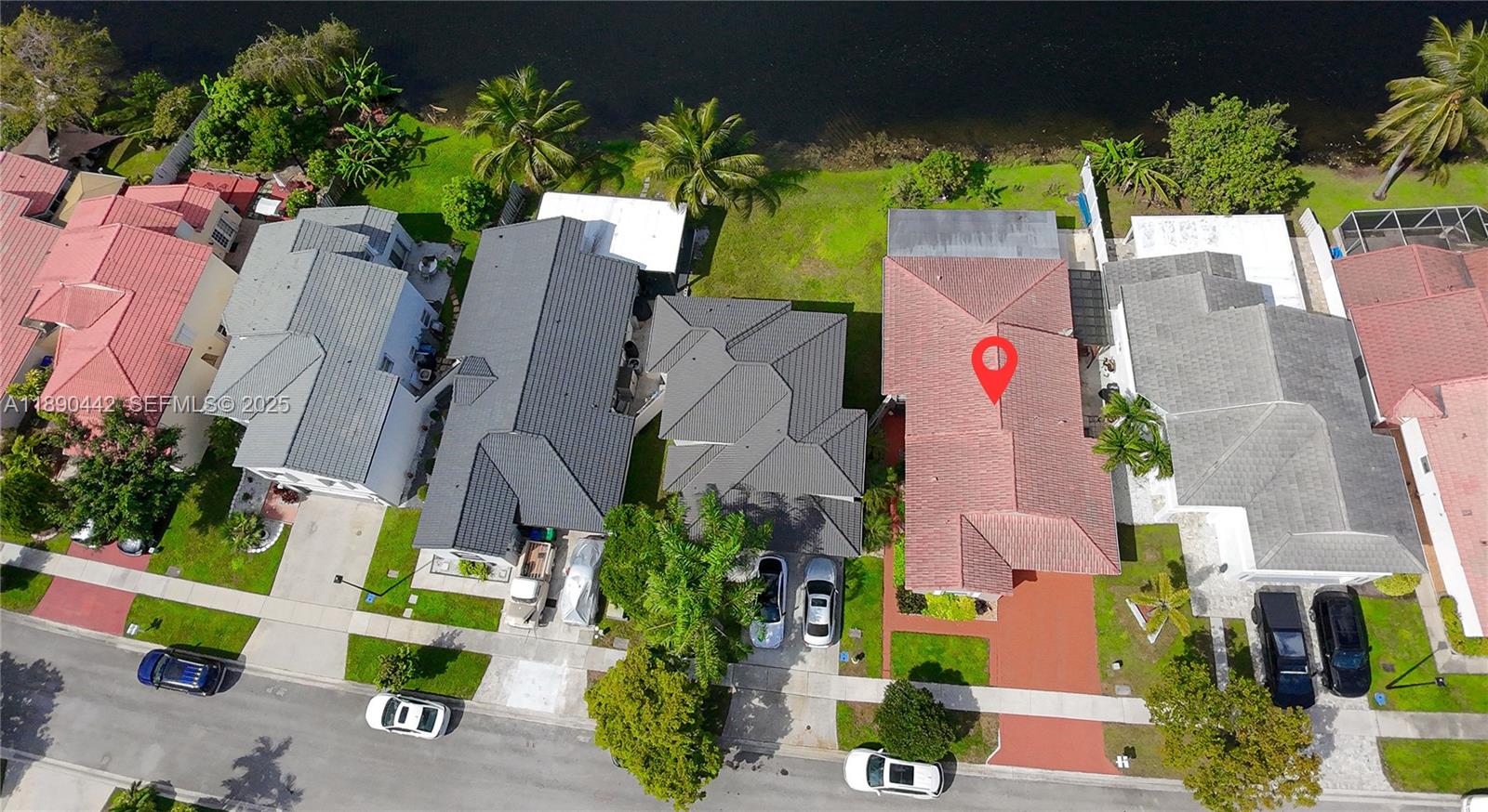 4810 Southwest 153rd Terrace Miramar, FL 33027 - Photo 32 of 41 an aerial view of a house with a yard and a garden