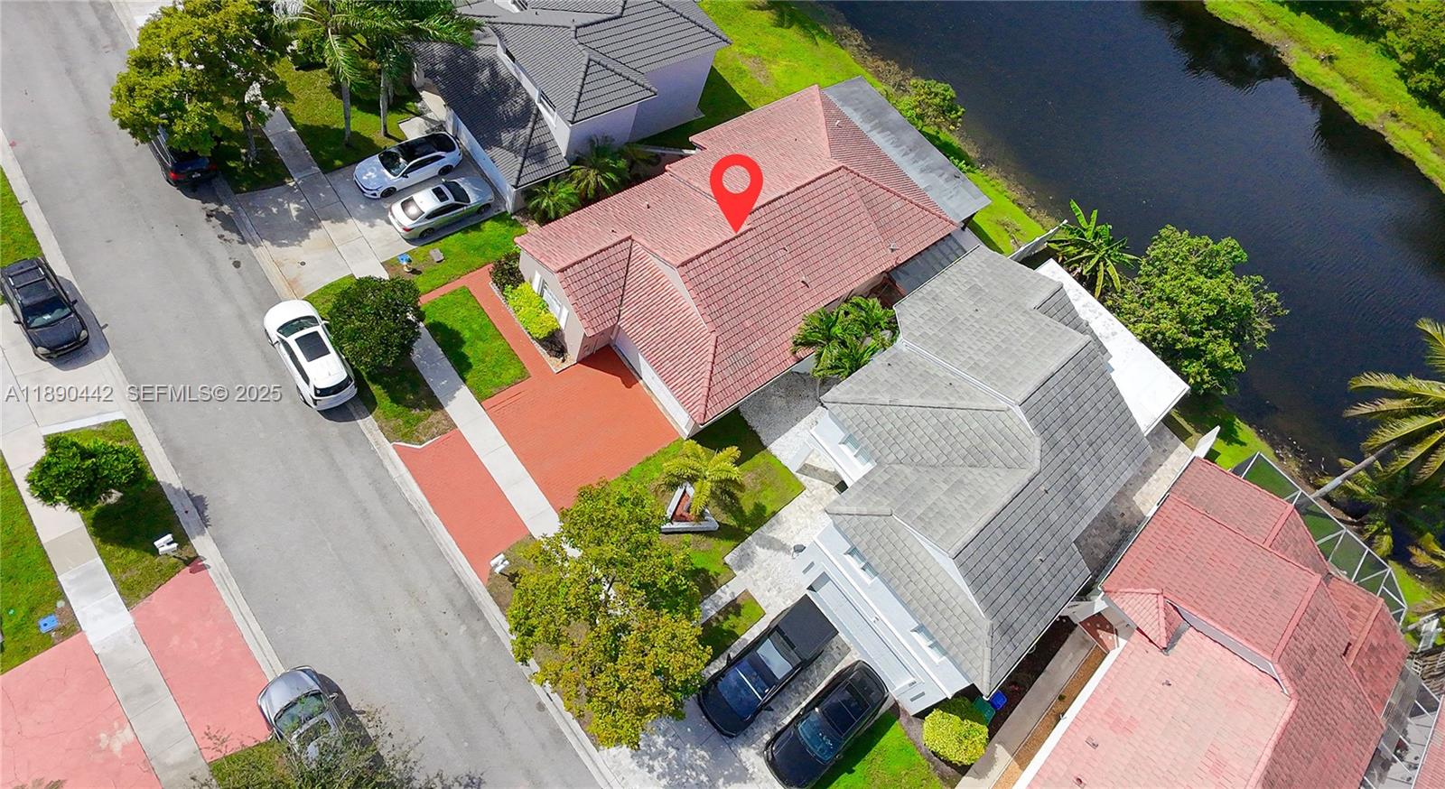 4810 Southwest 153rd Terrace Miramar, FL 33027 - Photo 33 of 41 an aerial view of a house with a yard and tennis court