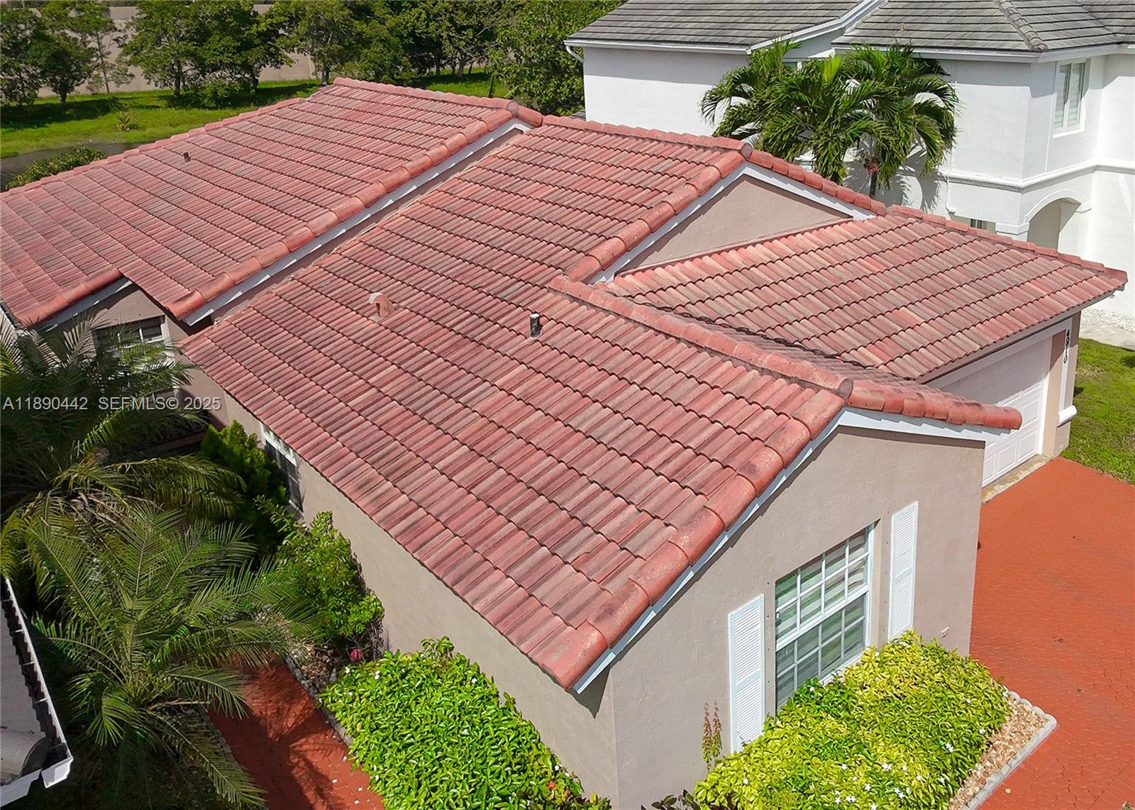 4810 Southwest 153rd Terrace Miramar, FL 33027 - Photo 39 of 41 a view of a backyard with plants and a patio