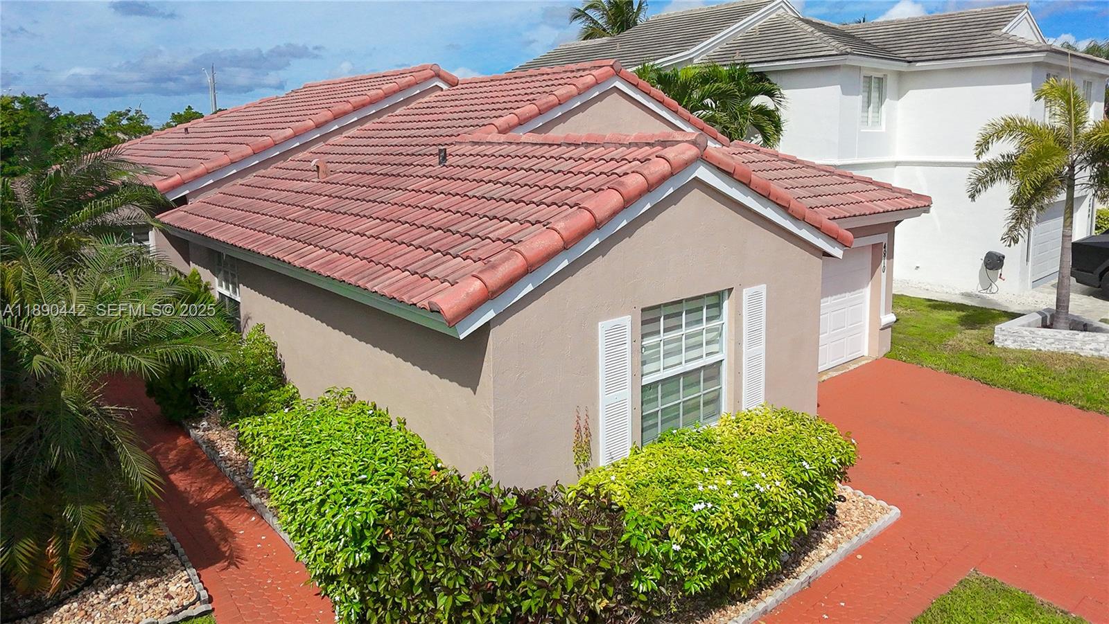 4810 Southwest 153rd Terrace Miramar, FL 33027 - Photo 40 of 41 a aerial view of a house with a yard and potted plants