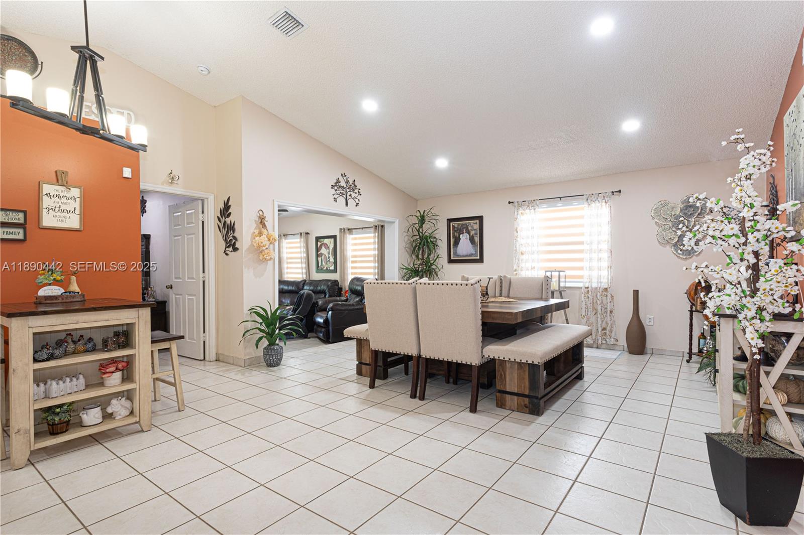 4810 Southwest 153rd Terrace Miramar, FL 33027 - Photo 6 of 41 a living room with furniture and a dining table with chairs