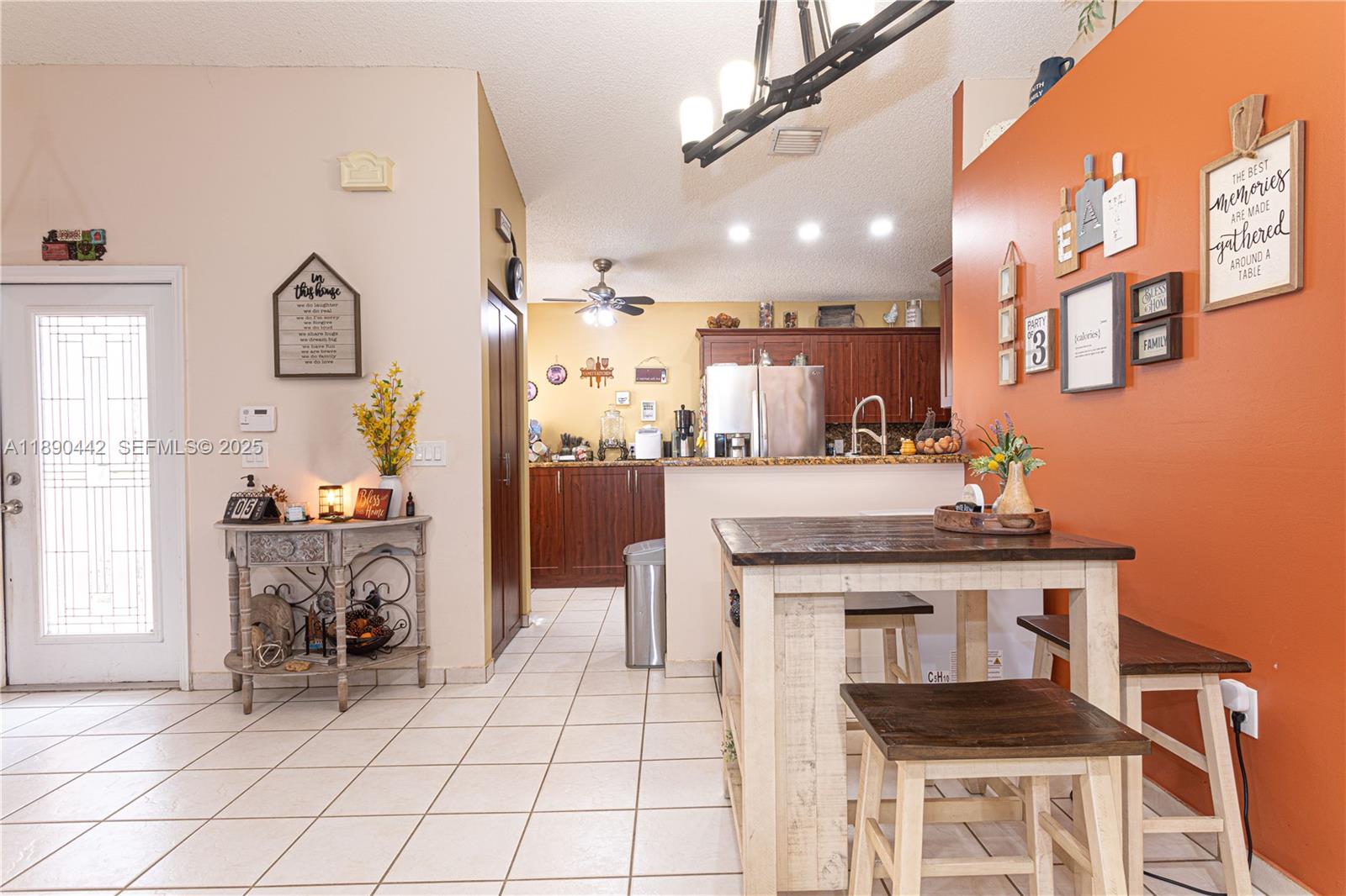 4810 Southwest 153rd Terrace Miramar, FL 33027 - Photo 10 of 41 a kitchen with cabinets and chairs