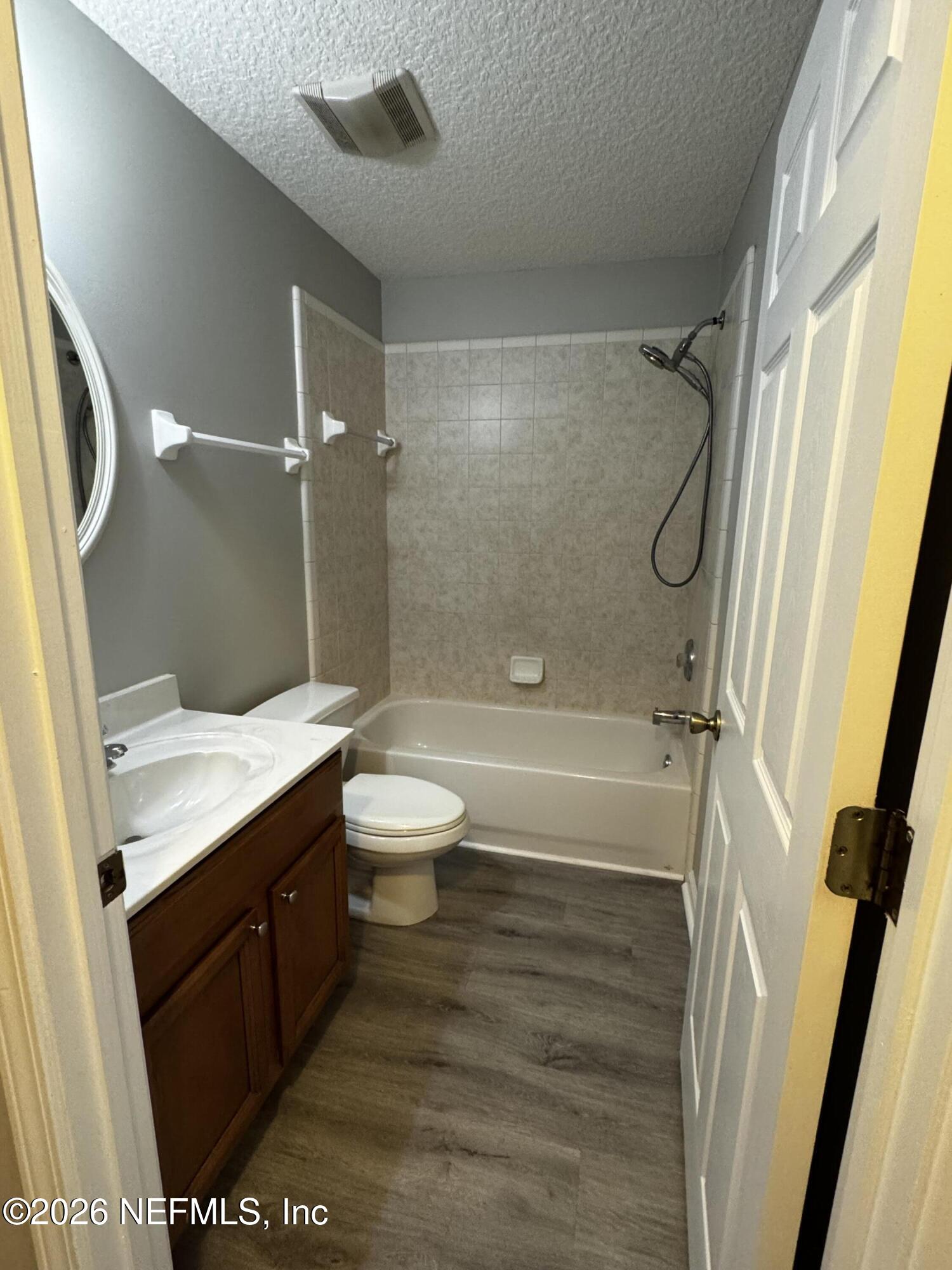 16255 Shellcracker Road Jacksonville, FL 32226 - Photo 26 of 40 a bathroom with a granite countertop sink toilet and shower