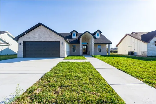 a front view of house with yard
