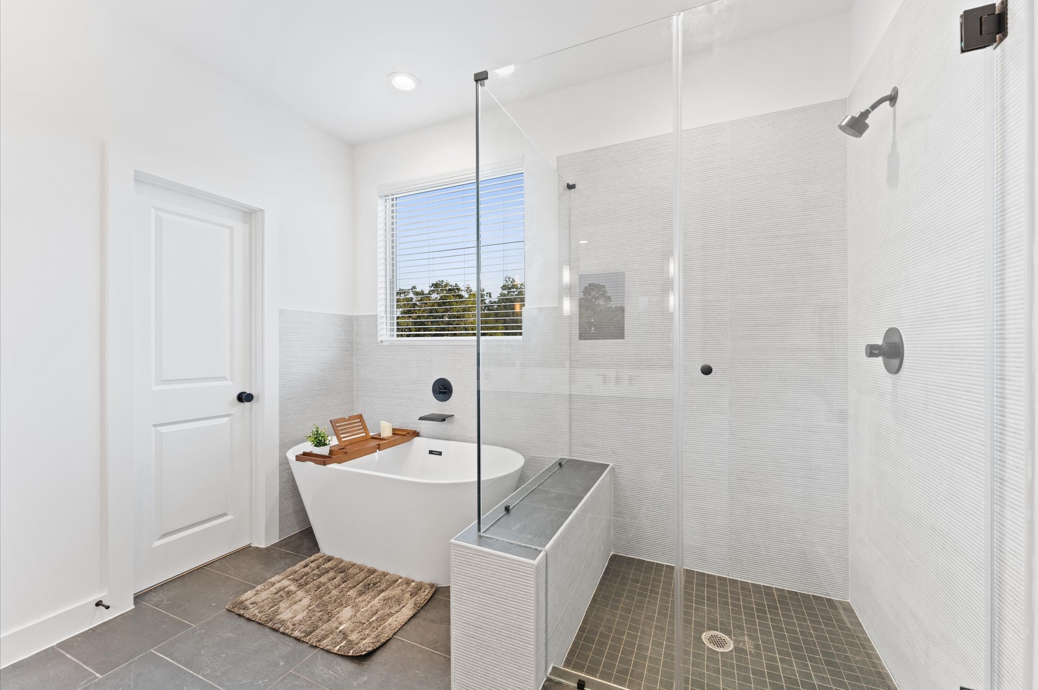7805 Amelia Road, Unit B Houston, TX 77055 - Photo 31 of 35 Primary bath. Photos are from a previous NJA Homes development. Floor plan, finishes & specifications may vary.