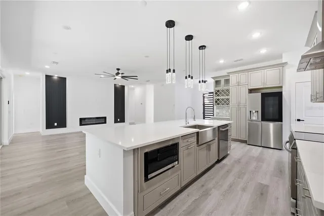a view of an empty room with a ceiling fan