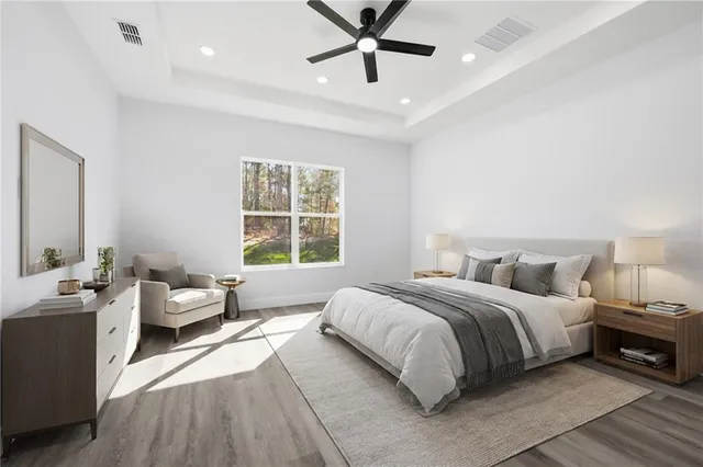 a room with walk in closet and wooden shelves