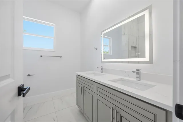 an empty room with windows and entrance