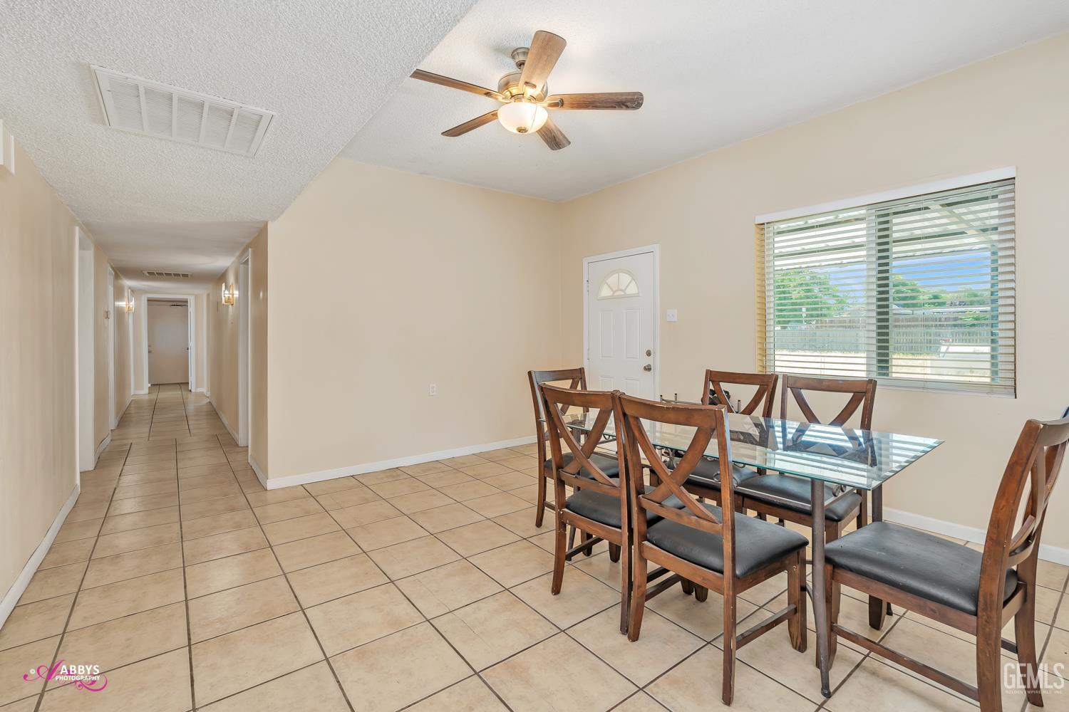 Undisclosed Address Bakersfield, CA 93307 - Photo 45 of 62 a view of a dining room with furniture and a chandelier