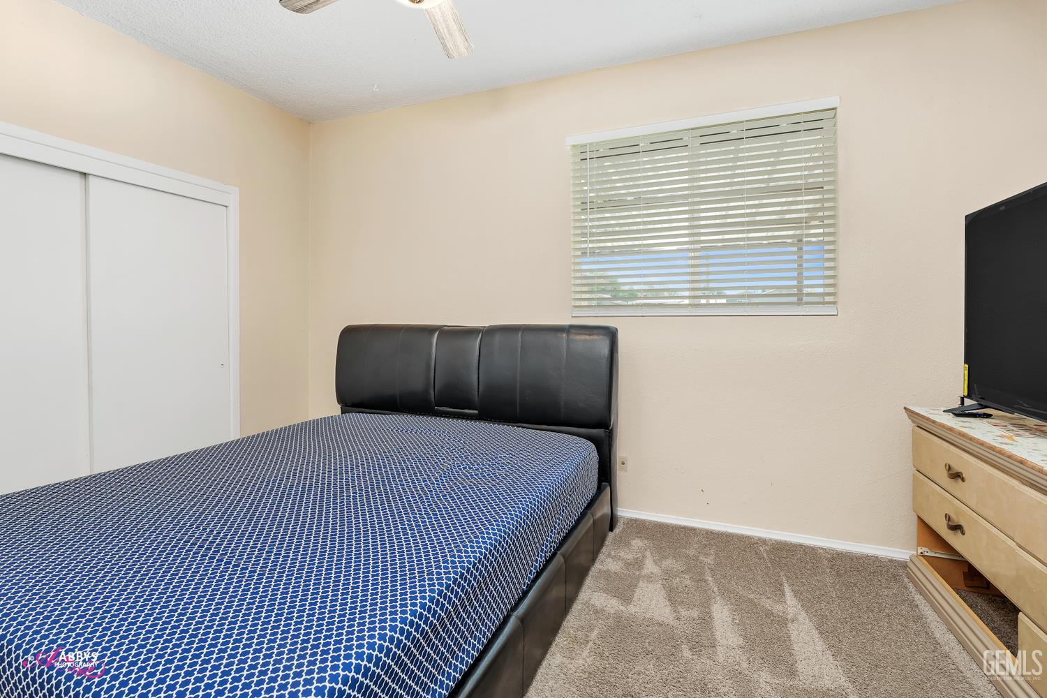 Undisclosed Address Bakersfield, CA 93307 - Photo 55 of 62 a bedroom with a bed and a flat screen tv