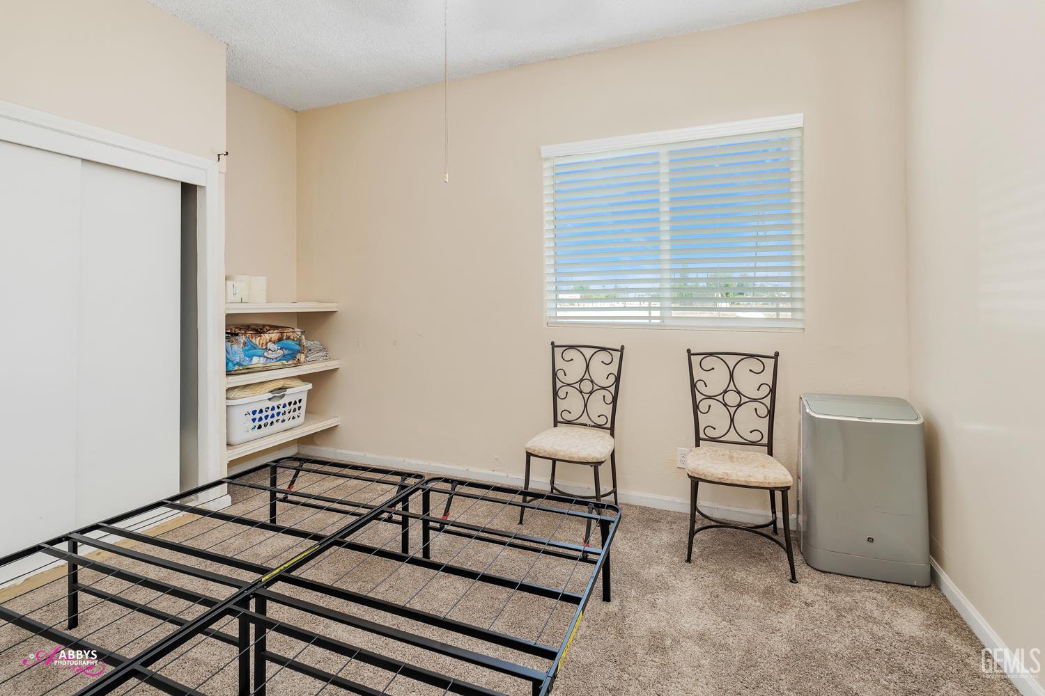 Undisclosed Address Bakersfield, CA 93307 - Photo 57 of 62 a bedroom with furniture and a window