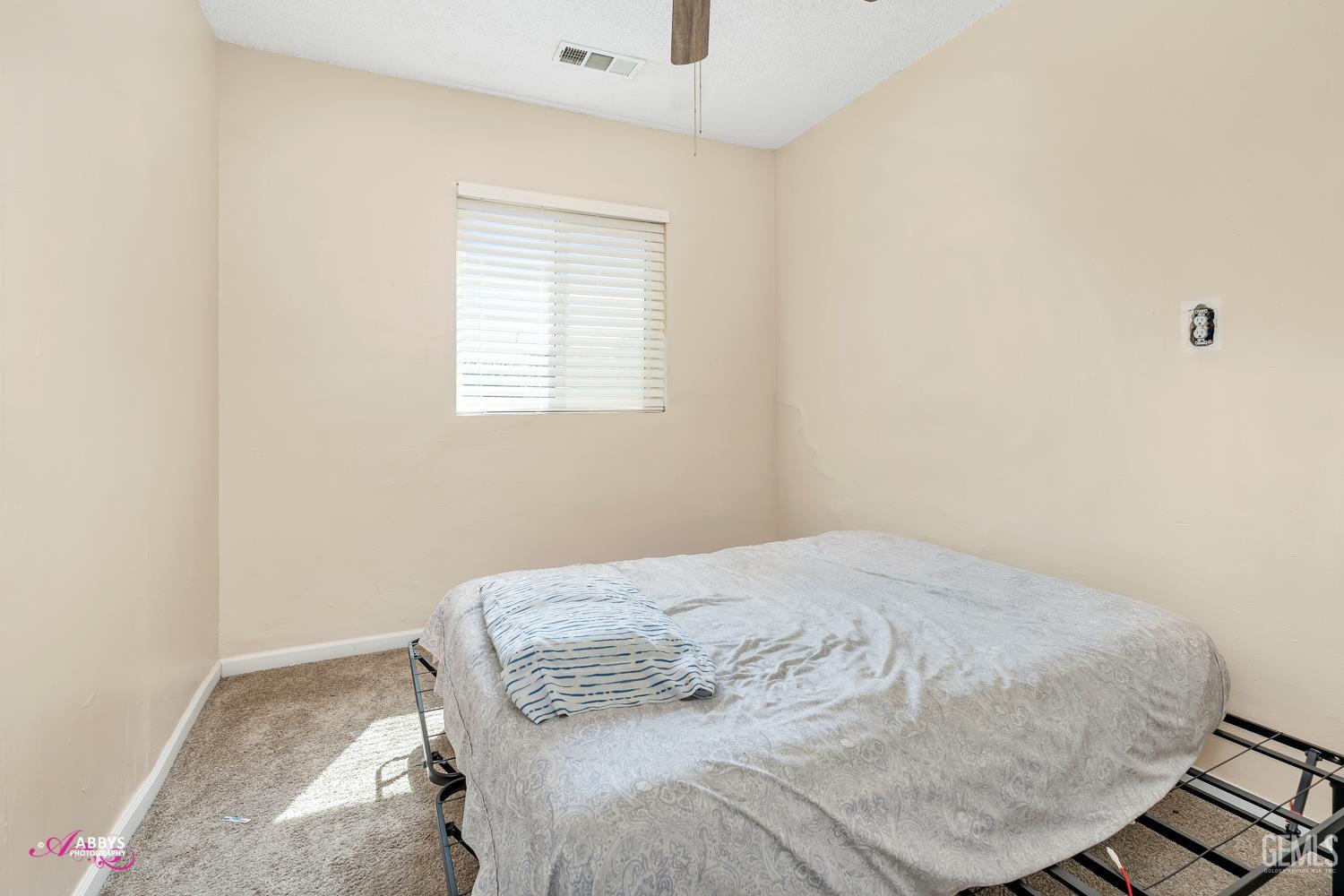 Undisclosed Address Bakersfield, CA 93307 - Photo 59 of 62 a bedroom with a bed and a window