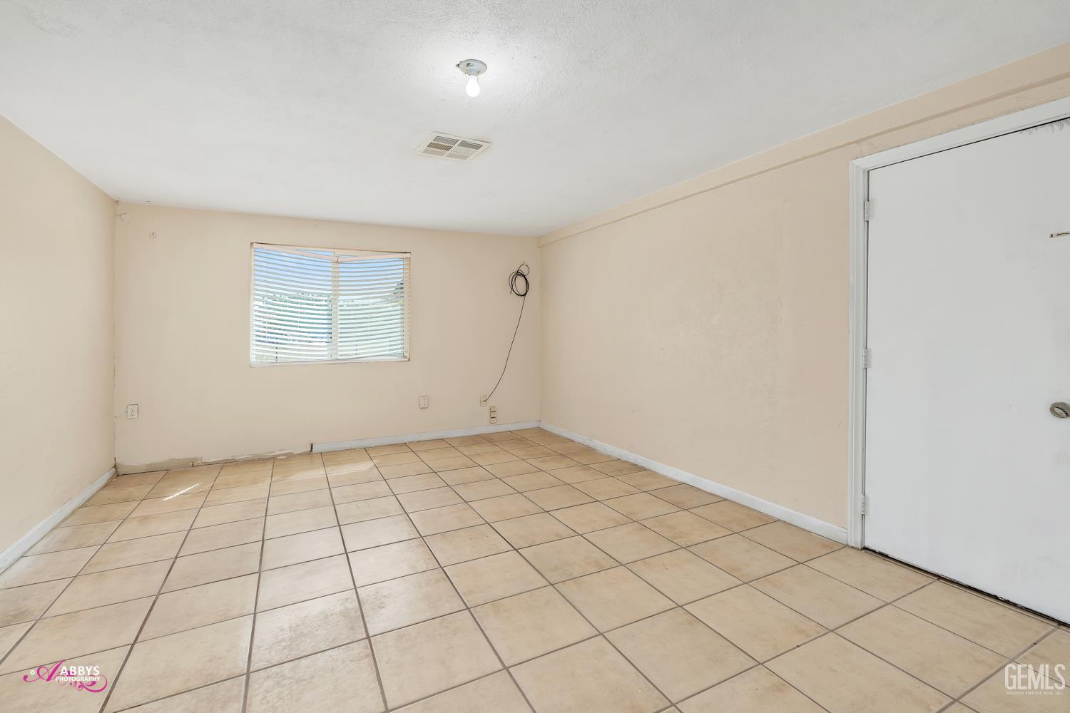 Undisclosed Address Bakersfield, CA 93307 - Photo 60 of 62 a view of an empty room and window
