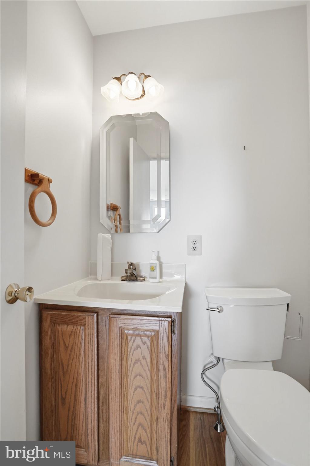 24 Normal Terrace Baltimore, MD 21286 - Photo 19 of 37 a bathroom with a toilet a sink and mirror