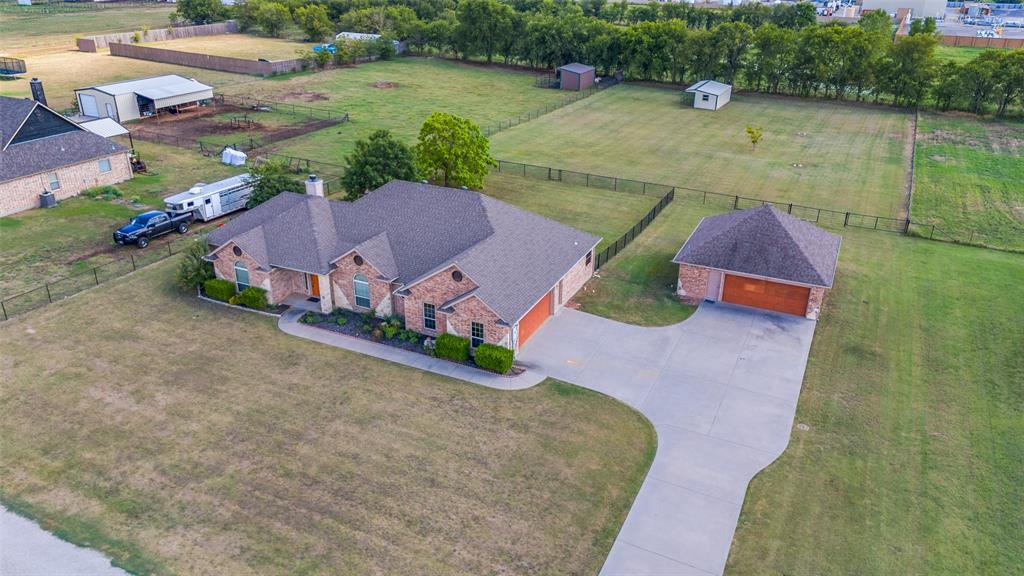 an aerial view of a house with outdoor space