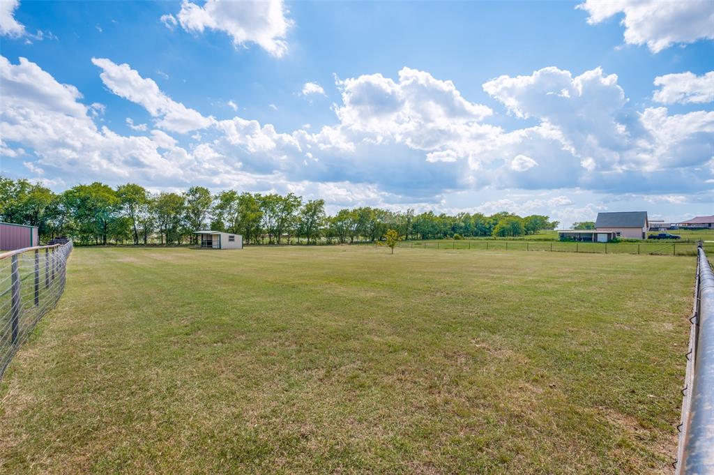 9213 Chisum Road DISH, TX 76247 - Photo 24 of 31 a view of a lake with houses in the back
