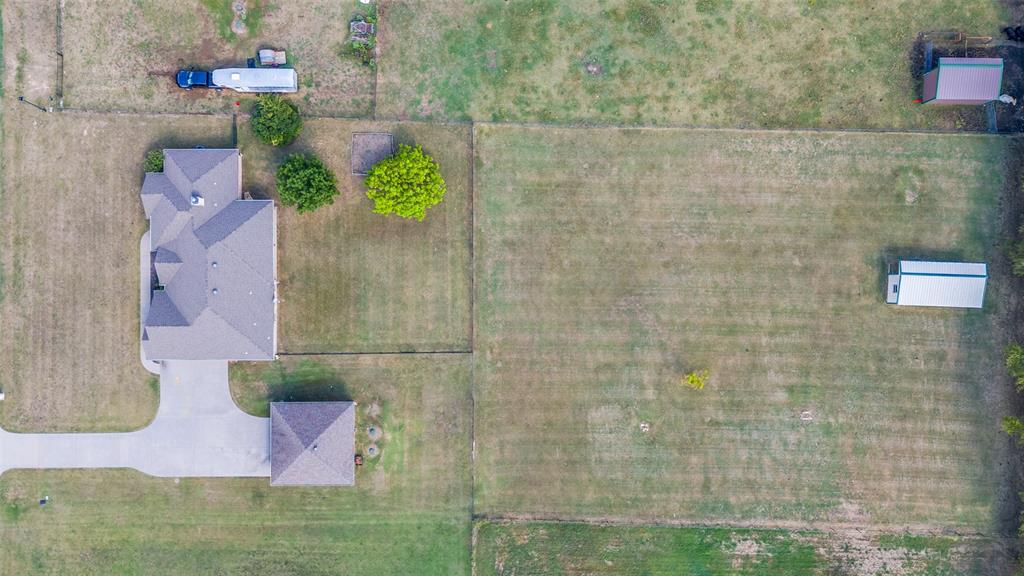 9213 Chisum Road DISH, TX 76247 - Photo 27 of 31 a bathroom with a sink mirror and vanity