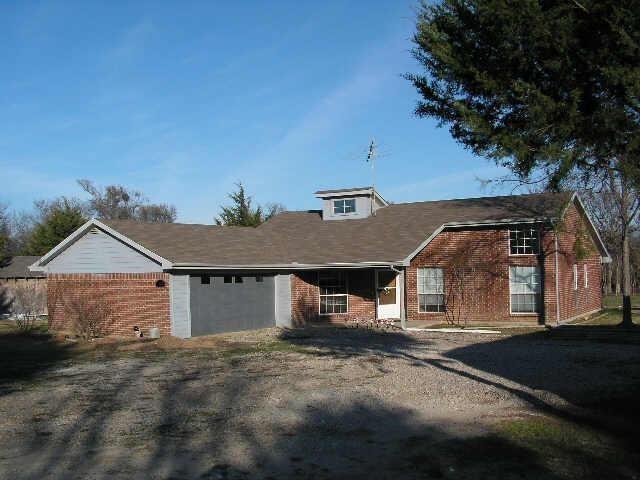 View of front of property with brick siding