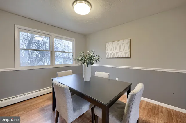 a dining room with furniture and window