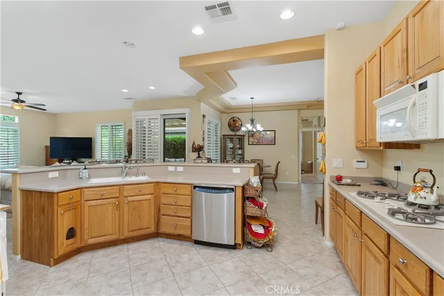 a kitchen with sink and cabinets