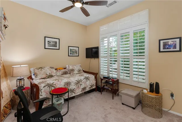 a bedroom with bed and a window