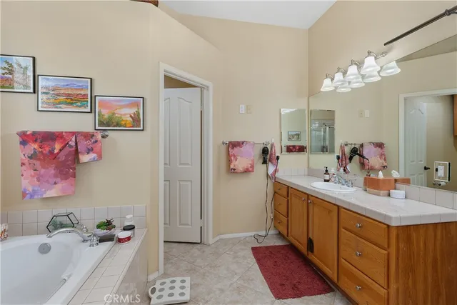 a bathroom with a sink double vanity and a mirror