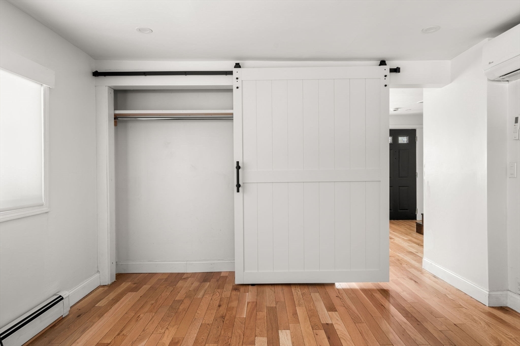 271 Broadway Haverhill, MA 01832 - Photo 9 of 41 a view of walk in closet with wooden floor