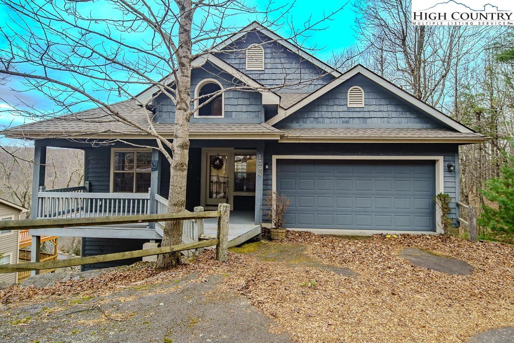 1394 Grandview Drive Extension Boone, NC 28607 - Photo 2 of 44 a front view of a house with a yard and garage