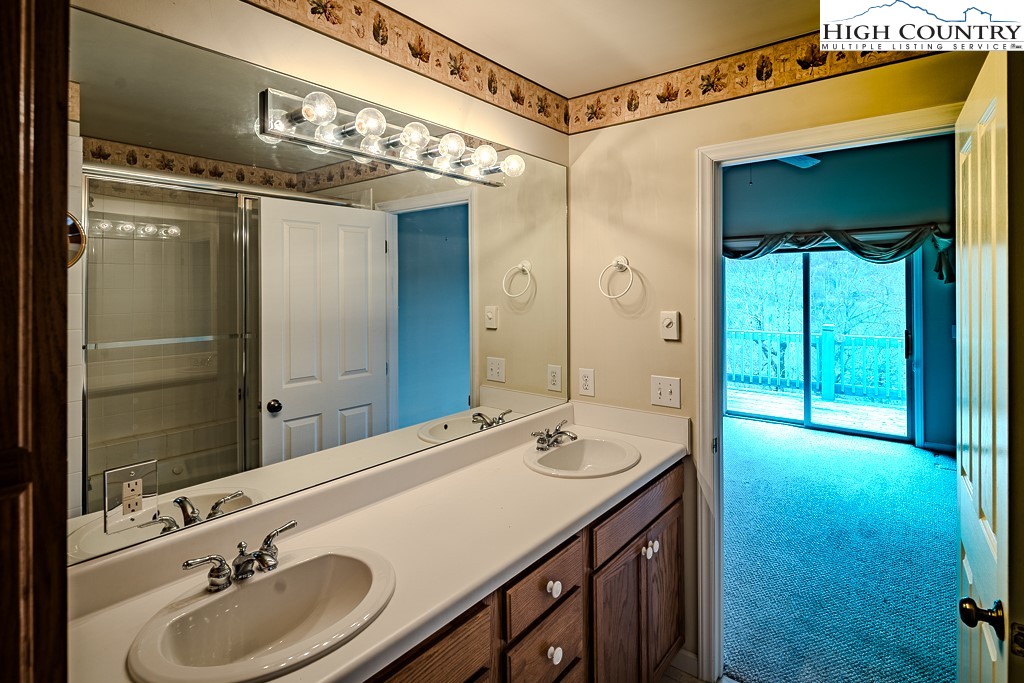 1394 Grandview Drive Extension Boone, NC 28607 - Photo 21 of 44 a bathroom with a double vanity sink and mirror