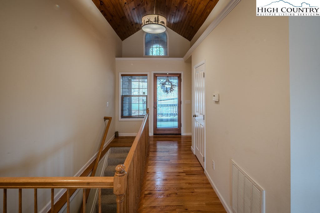 1394 Grandview Drive Extension Boone, NC 28607 - Photo 22 of 44 a view of a hallway with wooden floor and staircase