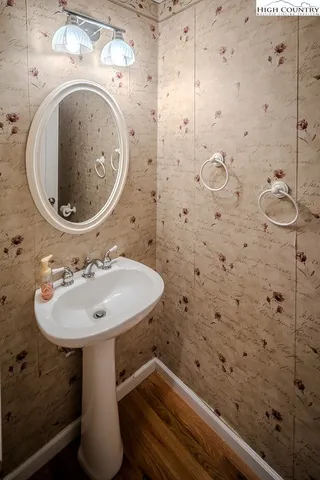a utility room with dryer washer and a view of living room