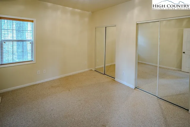 a view of a room that has a window in it