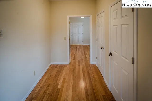 a view of a balcony with wooden floor