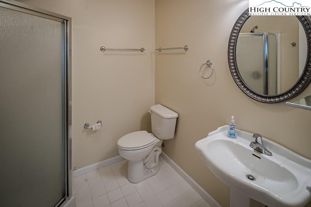 1394 Grandview Drive Extension Boone, NC 28607 - Photo 40 of 44 a bathroom with a sink and a mirror