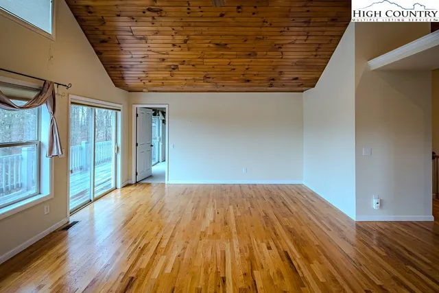 a view of a room with wooden floor and staircase