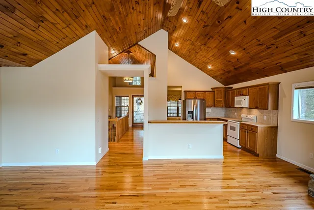 a view of a kitchen with a sink and microwave