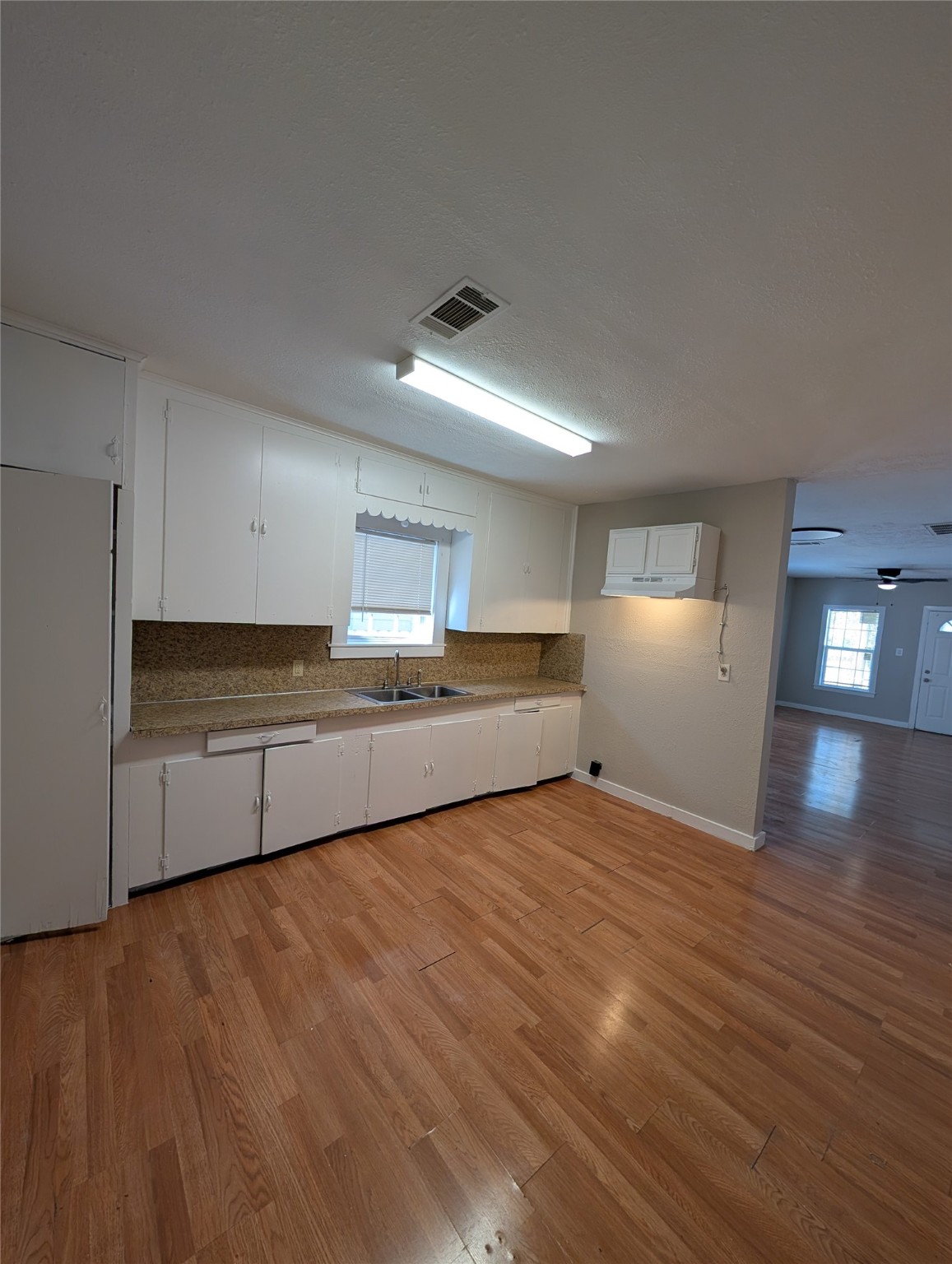 2125 Nora Street Beaumont, TX 77705 - Photo 3 of 13 a kitchen with stainless steel appliances granite countertop a sink and cabinets