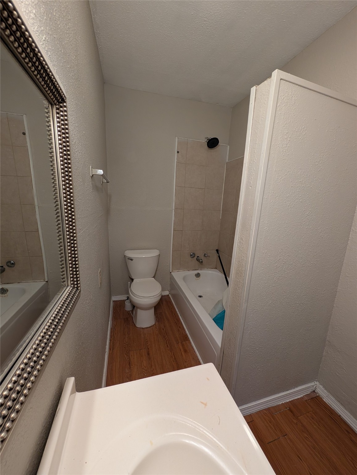 2125 Nora Street Beaumont, TX 77705 - Photo 5 of 13 a bathroom with a toilet and a shower