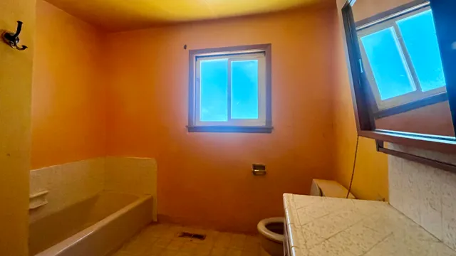 an empty room with windows