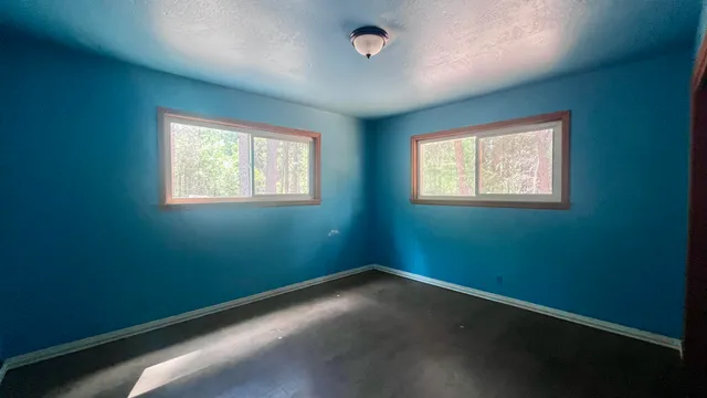 an empty room with windows